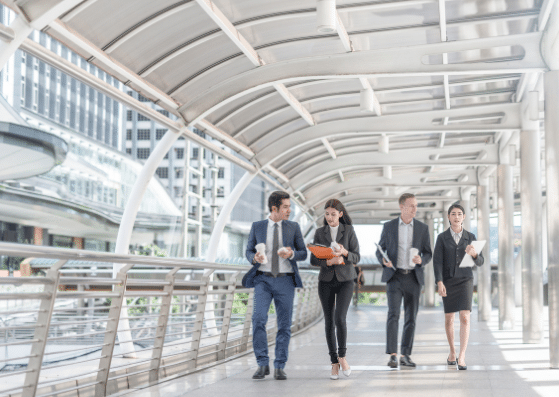 employees walking down office hallway
